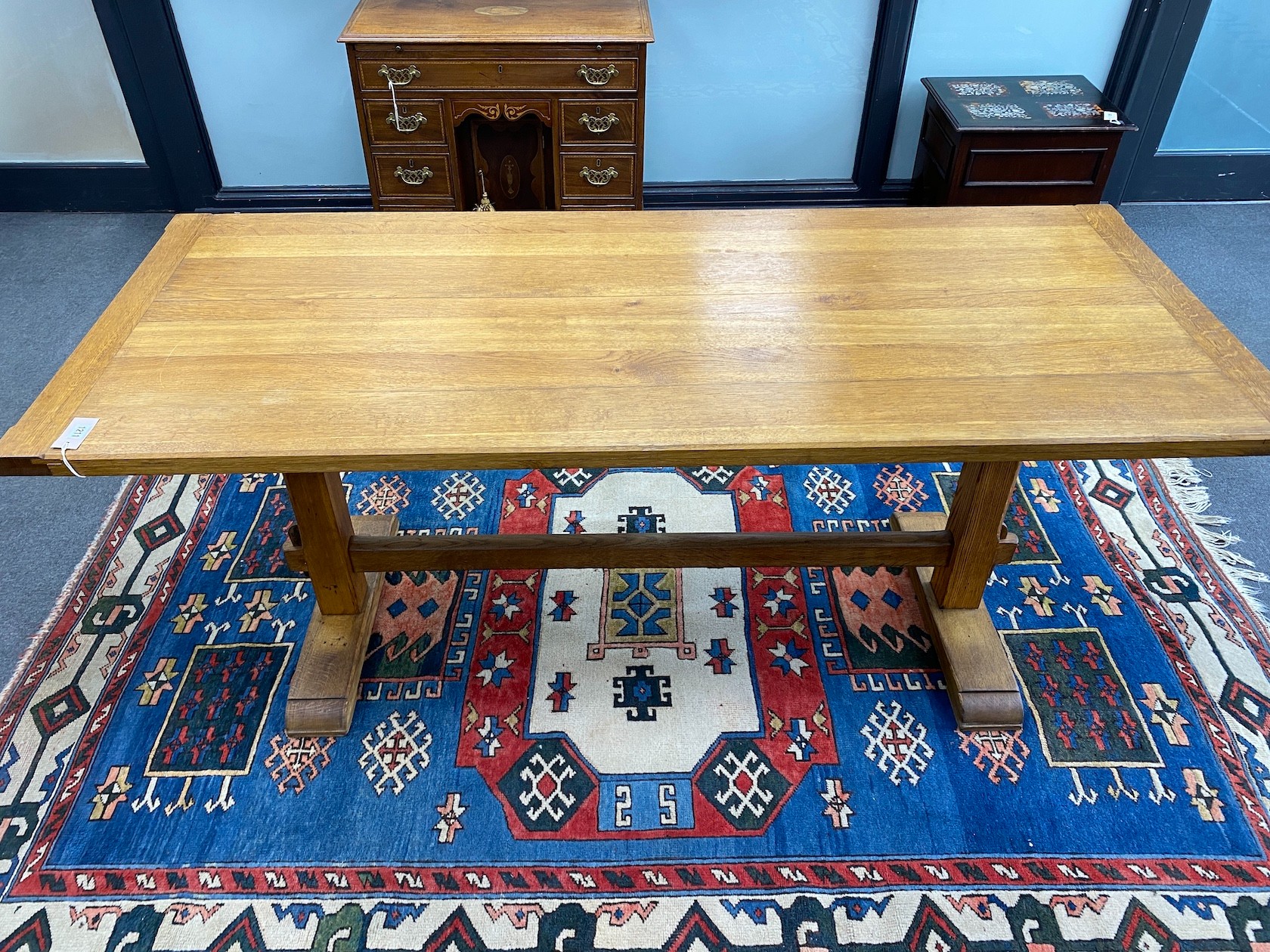 An Arts and Crafts style rectangular light oak refectory dining table, length 183cm, width 76cm, height 76cm